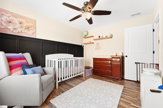 110 Avendell Dr, Easley, SC 29642 - bedroom with wood finished floors, a decorative wall, and ceiling fan