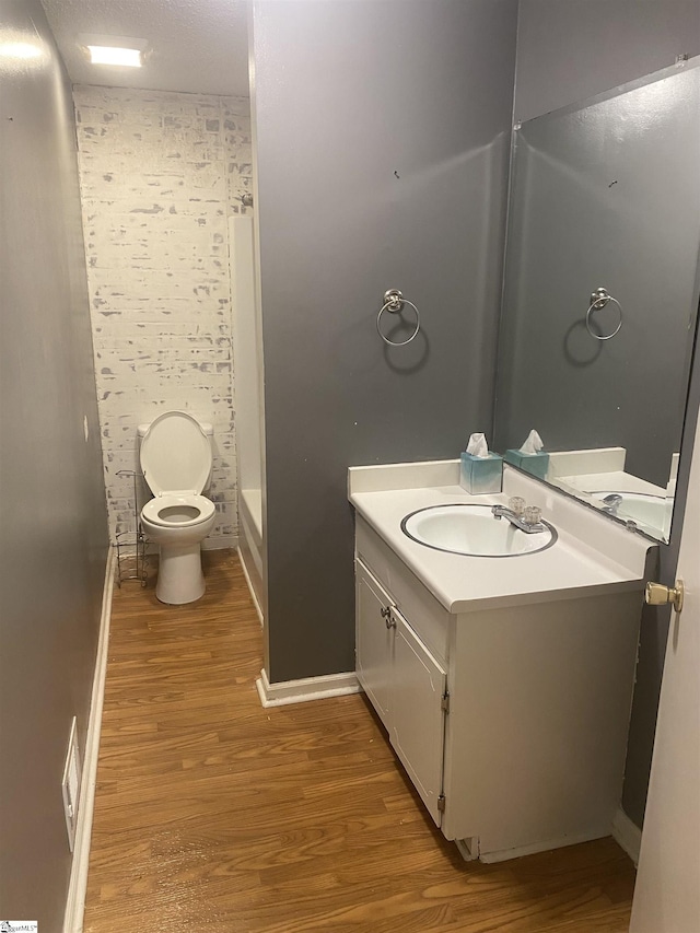 6 Powell Cir, Inman, SC 29349 - bathroom featuring wood finished floors, toilet, vanity, a shower, and baseboards