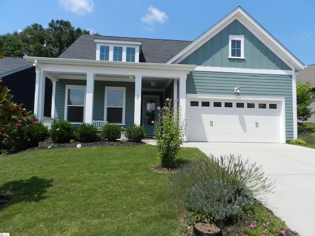 14 Moray Pl, Simpsonville, SC 29681 - view of front of property with concrete driveway, a front yard, board and batten siding, roof with shingles, and a porch