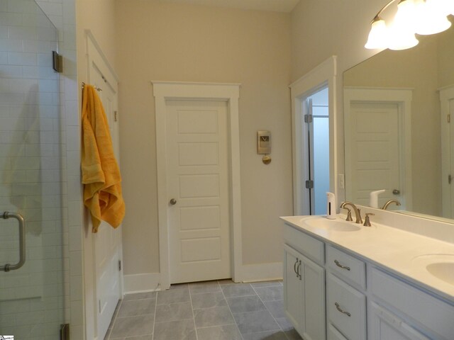 14 Moray Pl, Simpsonville, SC 29681 - full bathroom featuring a shower stall, double vanity, baseboards, and tile patterned floors