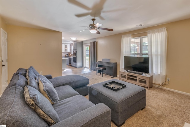 105 Bitternut Ln, Taylors, SC 29687 - living room featuring a ceiling fan, light carpet, and baseboards