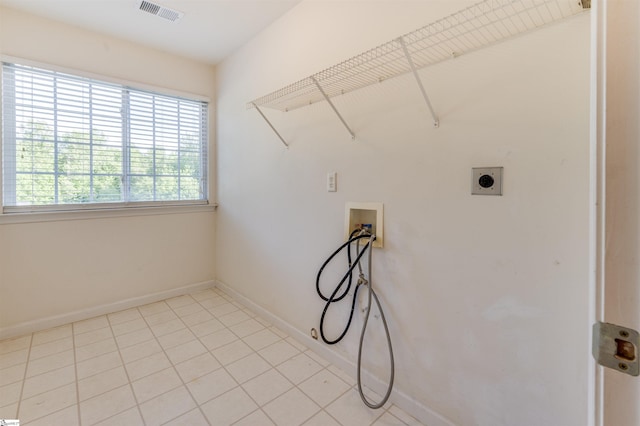 105 Bitternut Ln, Taylors, SC 29687 - clothes washing area featuring hookup for a washing machine, electric dryer hookup, baseboards, and light tile patterned floors