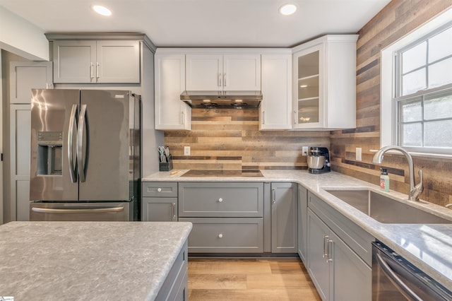 105 Bitternut Ln, Taylors, SC 29687 - kitchen featuring appliances with stainless steel finishes, under cabinet range hood, a sink, gray cabinetry, and recessed lighting