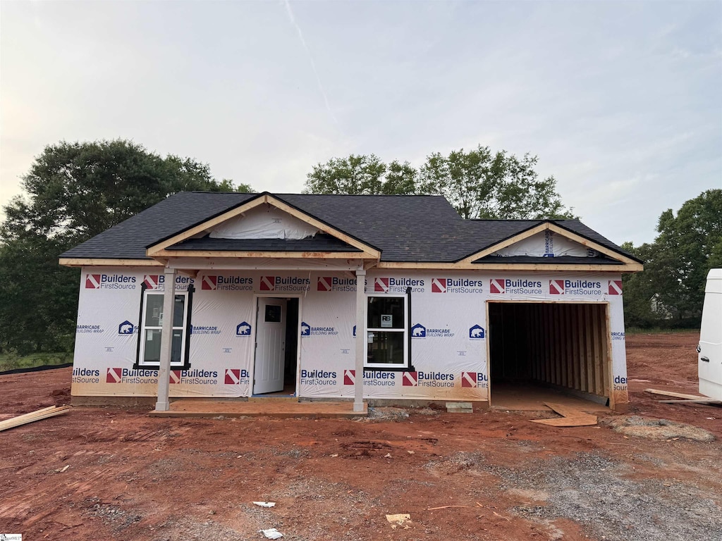 241 Woodgate Rd, Cowpens, SC 29330 - property in mid-construction with an attached garage, a shingled roof, and driveway
