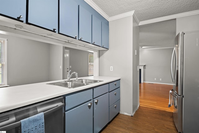 32 Circleview Dr, Taylors, SC 29687 - kitchen featuring stainless steel appliances, a sink, blue cabinets, dark wood-style floors, and a textured ceiling
