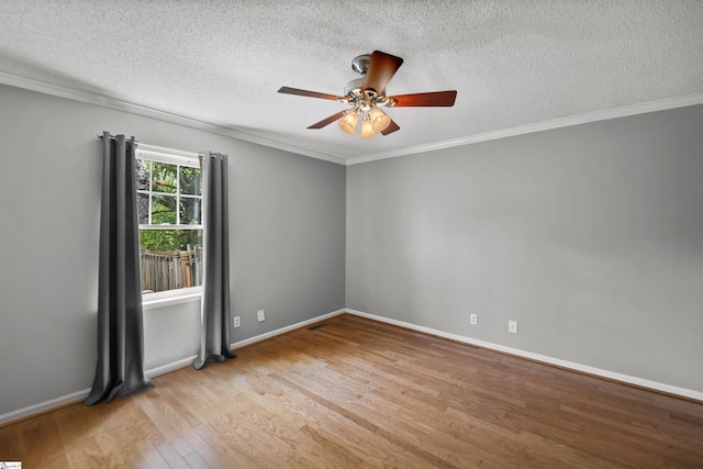 32 Circleview Dr, Taylors, SC 29687 - empty room with wood finished floors, a textured ceiling, a ceiling fan, ornamental molding, and baseboards