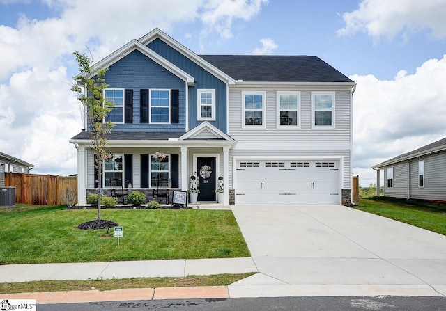view of front of home featuring a porch, a garage, concrete driveway, central air condition unit, and board and batten siding