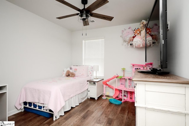 bedroom with wood finished floors, baseboards, and a ceiling fan