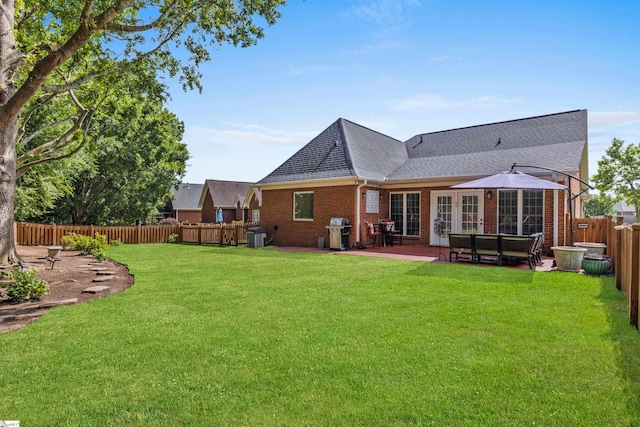413 Rambling Rose Way, Moore, SC 29369 - back of house featuring brick siding, roof with shingles, and a patio
