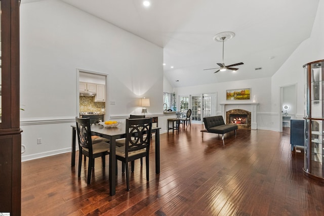 413 Rambling Rose Way, Moore, SC 29369 - dining space featuring ceiling fan, high vaulted ceiling, a fireplace, wood finished floors, and baseboards