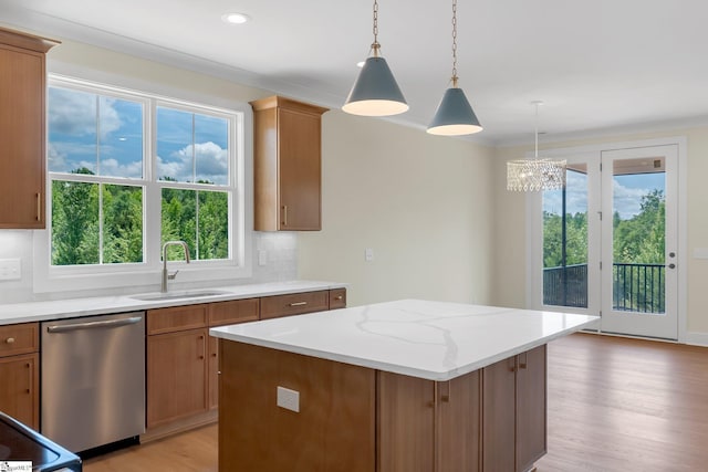 kitchen with dishwasher, a sink, light wood-style flooring, healthy amount of natural light, and recessed lighting