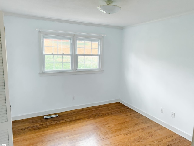 8 Charing Cross Rd, Taylors, SC 29687 - unfurnished room featuring baseboards, light wood-style floors, and ornamental molding