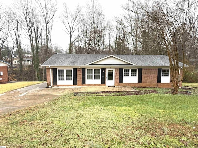 8 Charing Cross Rd, Taylors, SC 29687 - ranch-style house featuring brick siding, a front yard, and a shingled roof