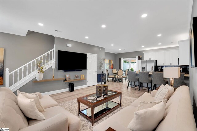 40 Ridgestone Cir, Mauldin, SC 29662 - living room featuring light wood-style flooring, stairway, and recessed lighting