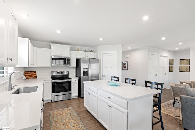 5 Timberwild Dr, Greenville, SC 29605 - kitchen with appliances with stainless steel finishes, a sink, a kitchen island, a kitchen breakfast bar, and open floor plan
