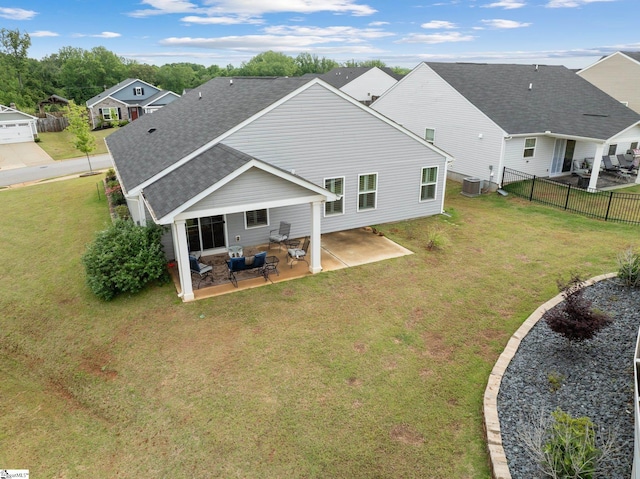 5 Timberwild Dr, Greenville, SC 29605 - back of property featuring roof with shingles, a patio, and central AC