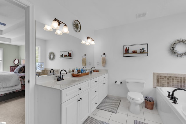 full bath featuring double vanity, ensuite bathroom, a garden tub, tile patterned flooring, and toilet