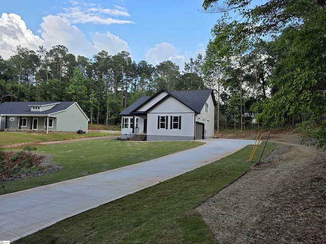 402 Edgewater Dr, Anderson, SC 29626 - view of front of home featuring concrete driveway, a front yard, and view of wooded area