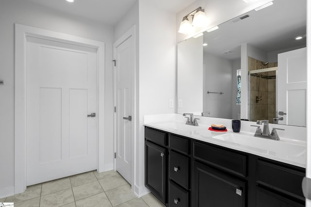 203 Bending Branch Rd, Greenville, SC 29605 - bathroom with a shower stall, tile patterned floors, double vanity, and recessed lighting