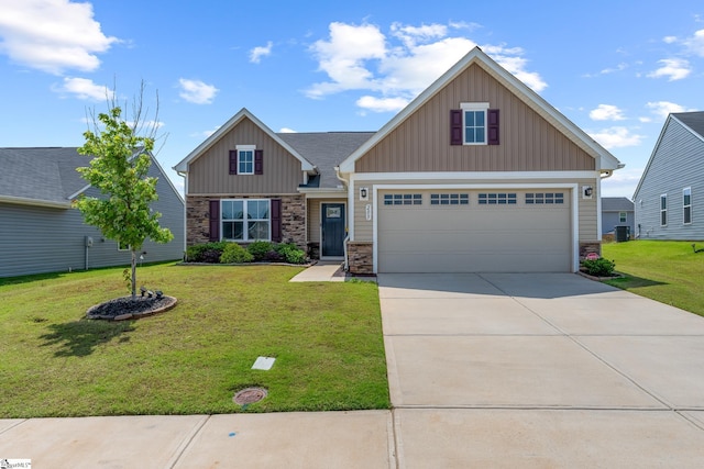 203 Bending Branch Rd, Greenville, SC 29605 - craftsman-style house with stone siding, board and batten siding, a front yard, and driveway