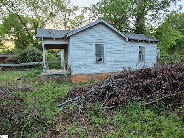 view of side of home with crawl space