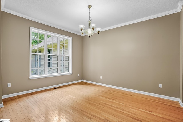 1298 Moorehead Pl, Pendleton, SC 29670 - empty room with a chandelier, ornamental molding, light wood-style flooring, baseboards, and a textured ceiling