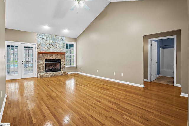 1298 Moorehead Pl, Pendleton, SC 29670 - unfurnished living room featuring high vaulted ceiling, ceiling fan, light wood-style floors, baseboards, and french doors