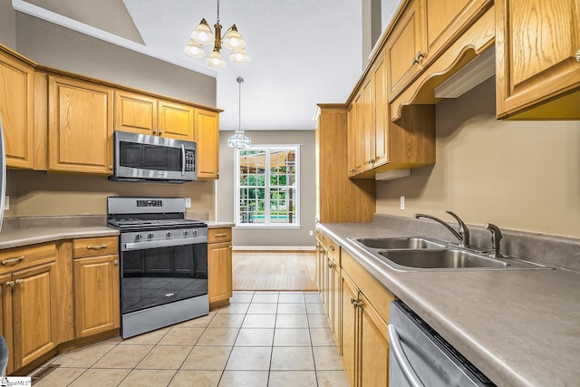 1298 Moorehead Pl, Pendleton, SC 29670 - kitchen with stainless steel appliances, a sink, a chandelier, decorative light fixtures, and light tile patterned floors