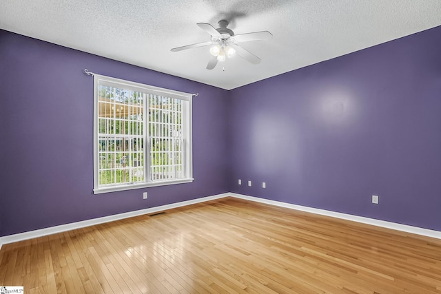1298 Moorehead Pl, Pendleton, SC 29670 - unfurnished room with wood-type flooring, baseboards, ceiling fan, and a textured ceiling
