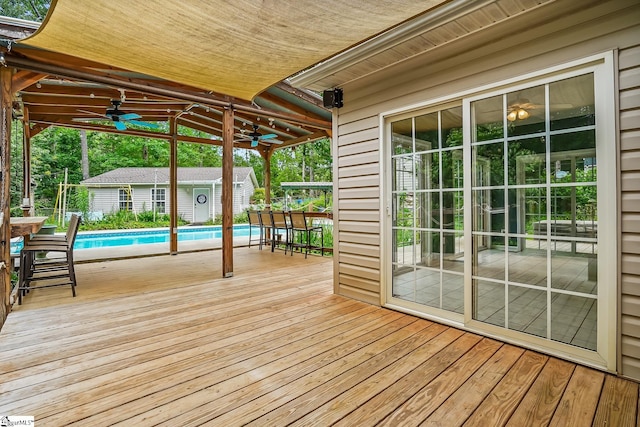 1298 Moorehead Pl, Pendleton, SC 29670 - wooden terrace with a ceiling fan and an outbuilding