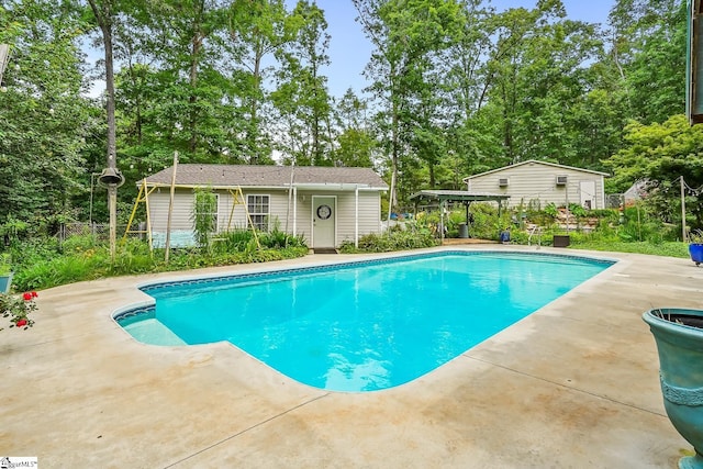 1298 Moorehead Pl, Pendleton, SC 29670 - swimming pool with a patio, an outbuilding, and view of wooded area