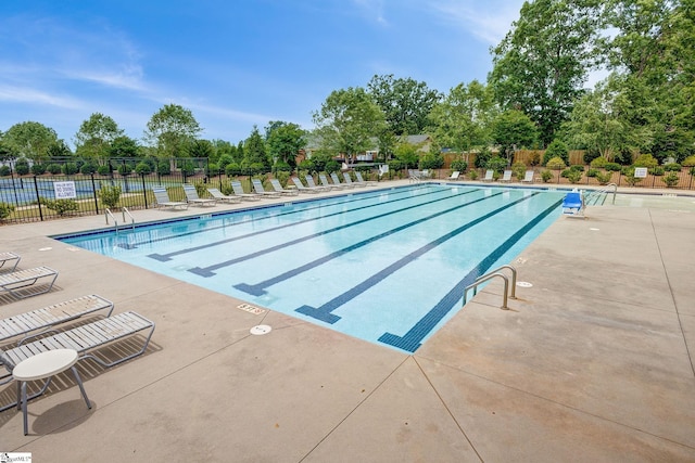 305 Yellow Fox Rd, Greer, SC 29650 - community pool with fence, view of scattered trees, and a patio area