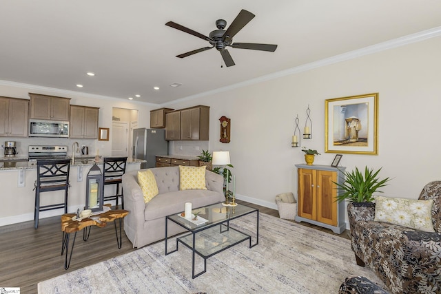 305 Yellow Fox Rd, Greer, SC 29650 - living room with ornamental molding, light wood-style floors, a ceiling fan, baseboards, and recessed lighting