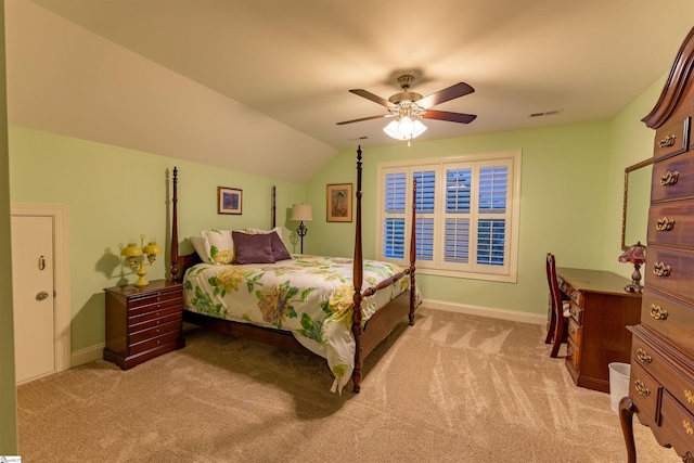 bedroom with light colored carpet, baseboards, ceiling fan, and lofted ceiling