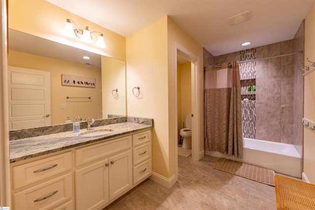 bathroom with toilet, vanity, shower / bath combination with curtain, tile patterned flooring, and baseboards