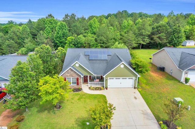 239 Walcott Dr, Lyman, SC 29365 - view of front of house with concrete driveway, roof mounted solar panels, a garage, and a front yard