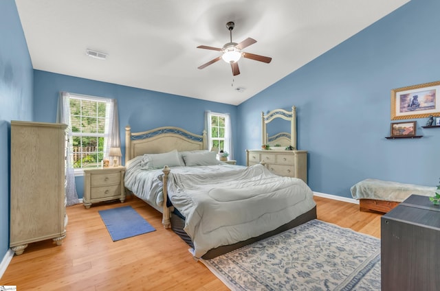 239 Walcott Dr, Lyman, SC 29365 - bedroom featuring multiple windows, vaulted ceiling, light wood-style floors, baseboards, and ceiling fan
