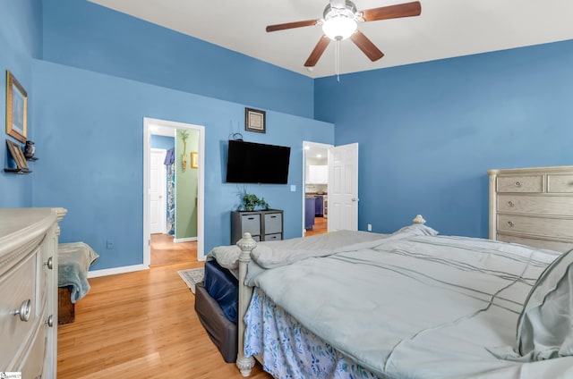 239 Walcott Dr, Lyman, SC 29365 - bedroom with light wood finished floors, vaulted ceiling, baseboards, and ceiling fan
