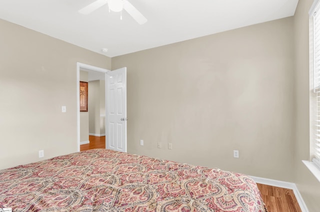 239 Walcott Dr, Lyman, SC 29365 - bedroom featuring a ceiling fan, multiple windows, wood finished floors, and baseboards