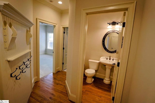 128 Palm Springs Way, Simpsonville, SC 29681 - bathroom with wood finished floors, toilet, crown molding, and baseboards