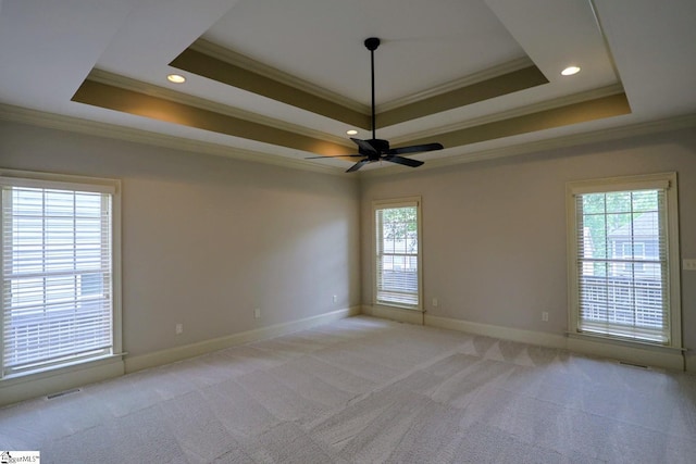 128 Palm Springs Way, Simpsonville, SC 29681 - unfurnished room with ornamental molding, a raised ceiling, a ceiling fan, baseboards, and light colored carpet