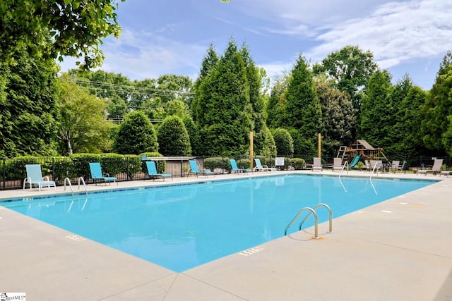 128 Palm Springs Way, Simpsonville, SC 29681 - community pool with fence, a patio area, and view of scattered trees