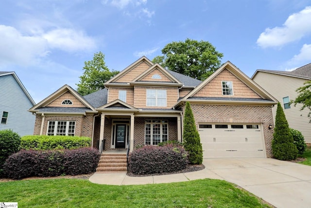 128 Palm Springs Way, Simpsonville, SC 29681 - craftsman-style home featuring brick siding, concrete driveway, and a front yard