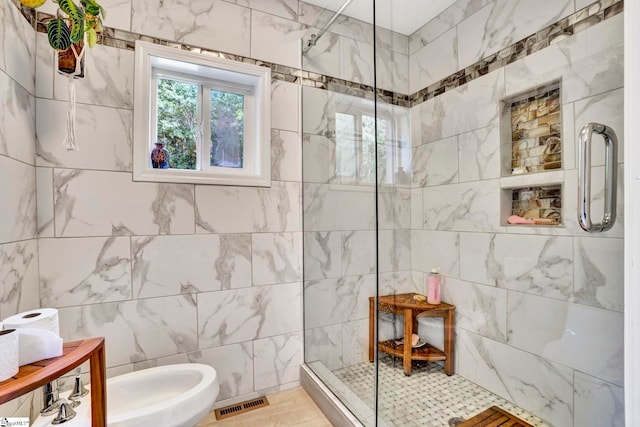313 Viewmont Dr, Greenville, SC 29609 - bathroom featuring walk in shower, tile walls, and a bidet