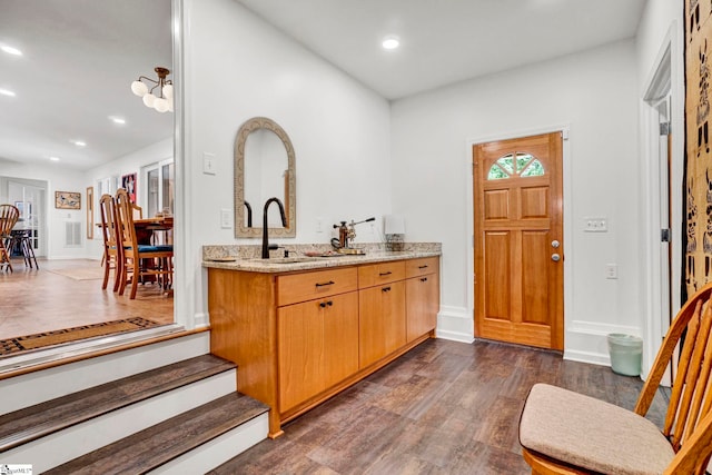 313 Viewmont Dr, Greenville, SC 29609 - bar featuring dark wood finished floors, recessed lighting, and baseboards