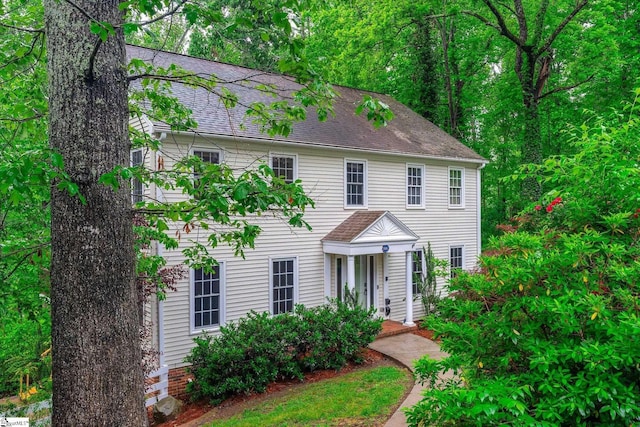 colonial house with a shingled roof