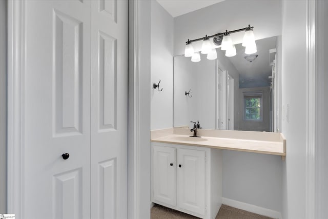 bathroom with vanity and baseboards