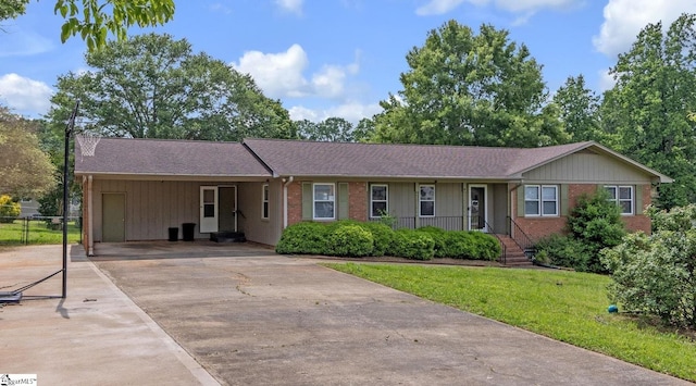 140 Greenbriar Dr, Gaffney, SC 29341 - ranch-style house with concrete driveway, a carport, a front yard, and brick siding