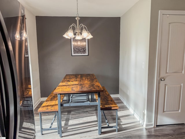 128 Adger Rd, Pendleton, SC 20670 - dining space with wood finished floors, a chandelier, and baseboards