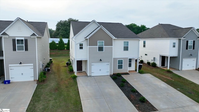 128 Adger Rd, Pendleton, SC 20670 - view of front of property with cooling unit, a front yard, concrete driveway, and board and batten siding